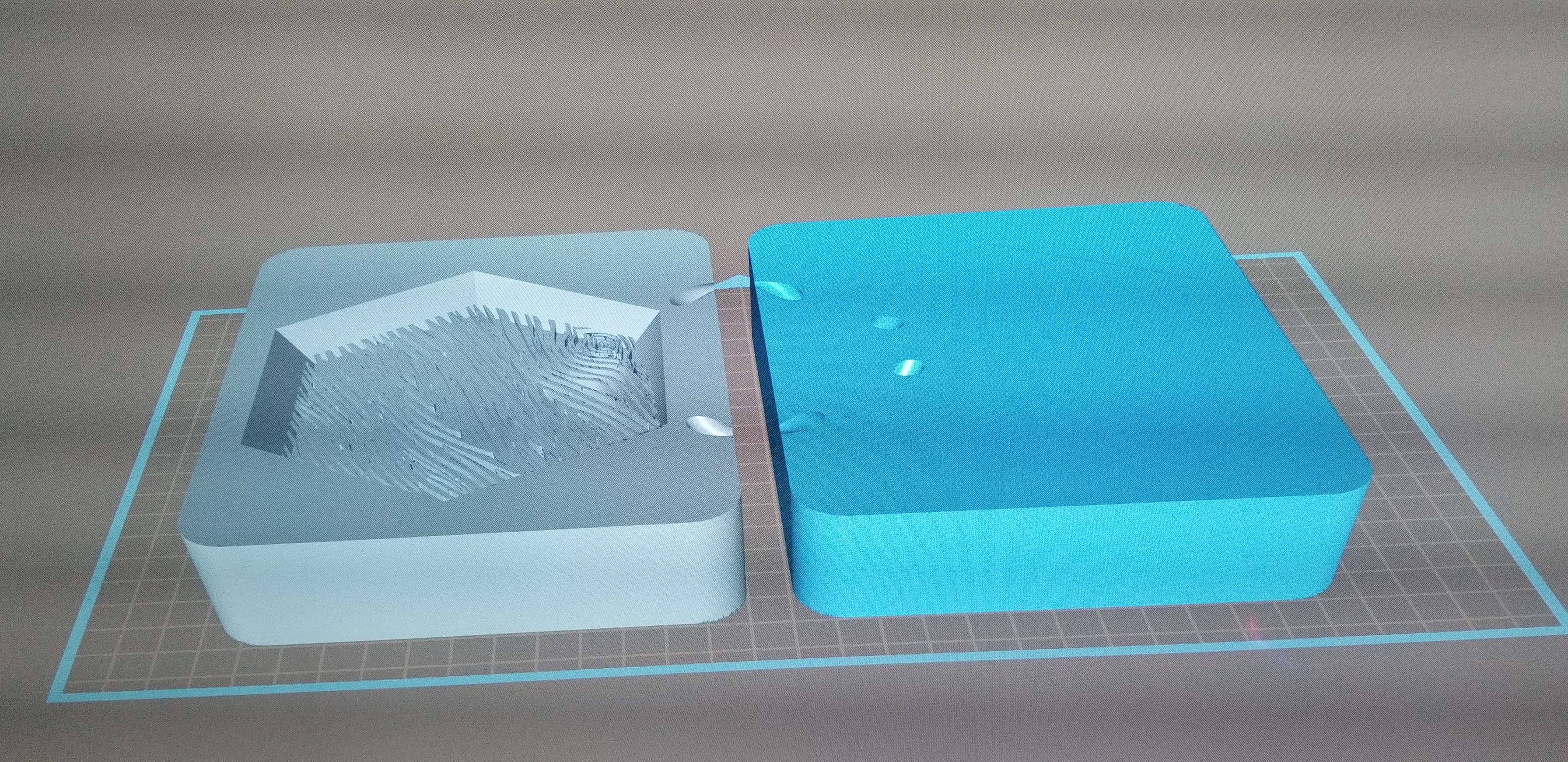 We designed the two halves of the mold with ports for the plastic to be injected into.
