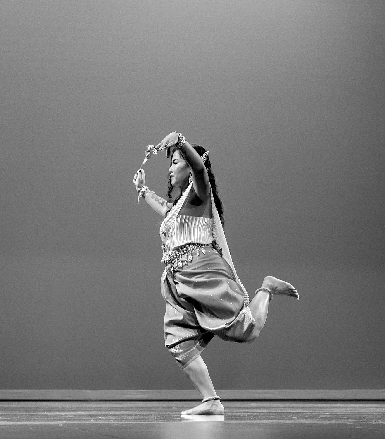 A dancer performs the Robam Phoung Neary on stage. “We think of this as a prayer and blessing. We send blessings to our ancestors, and we send blessings to the people who come to see us.”
