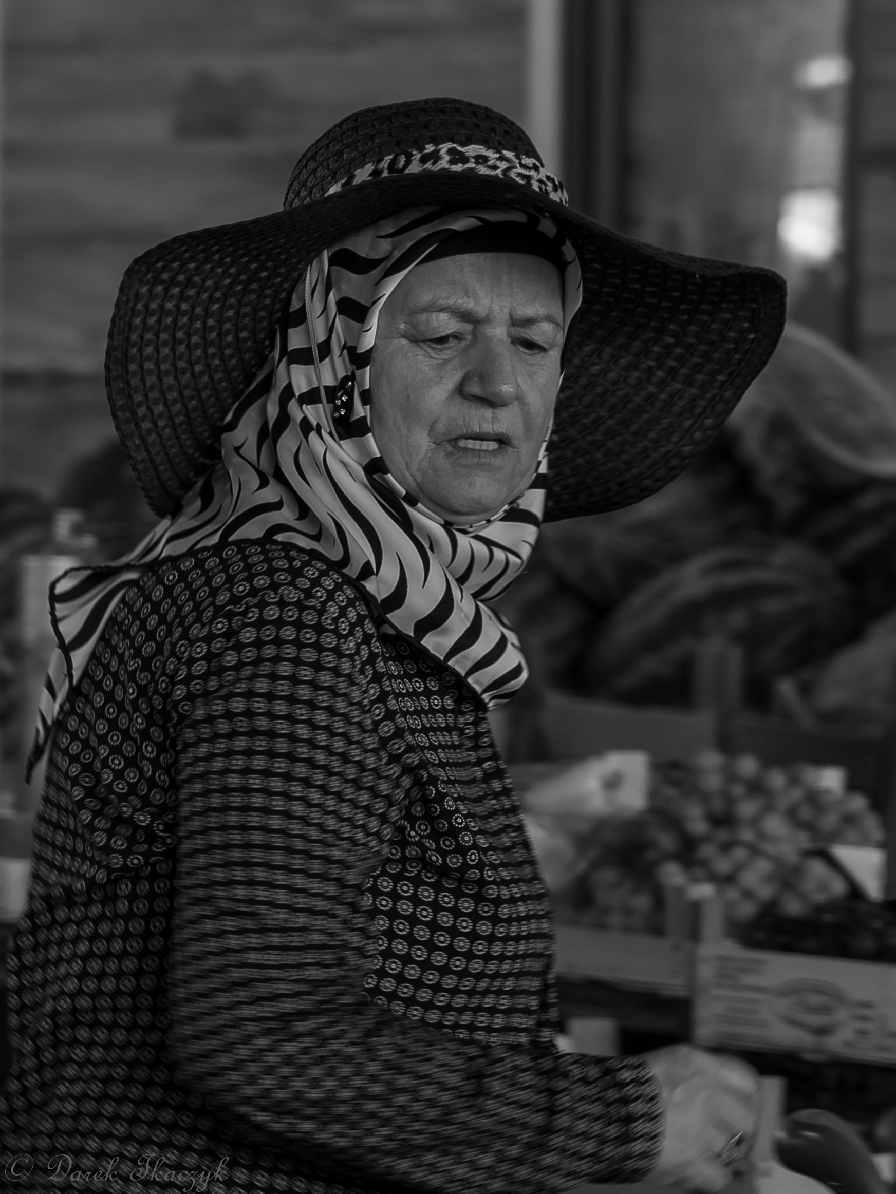 Woman in hat on the bazar