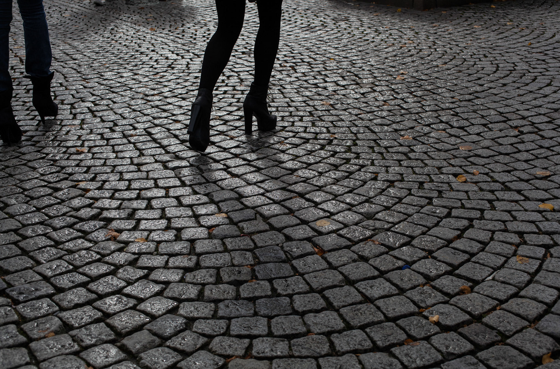 Two women in silhouette walking on the streets of Norway