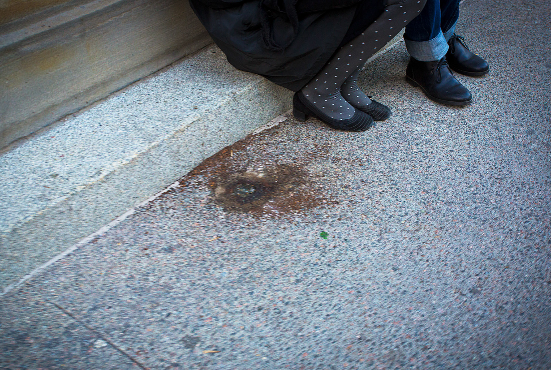 Man and woman snuggled together on the streets of New York City