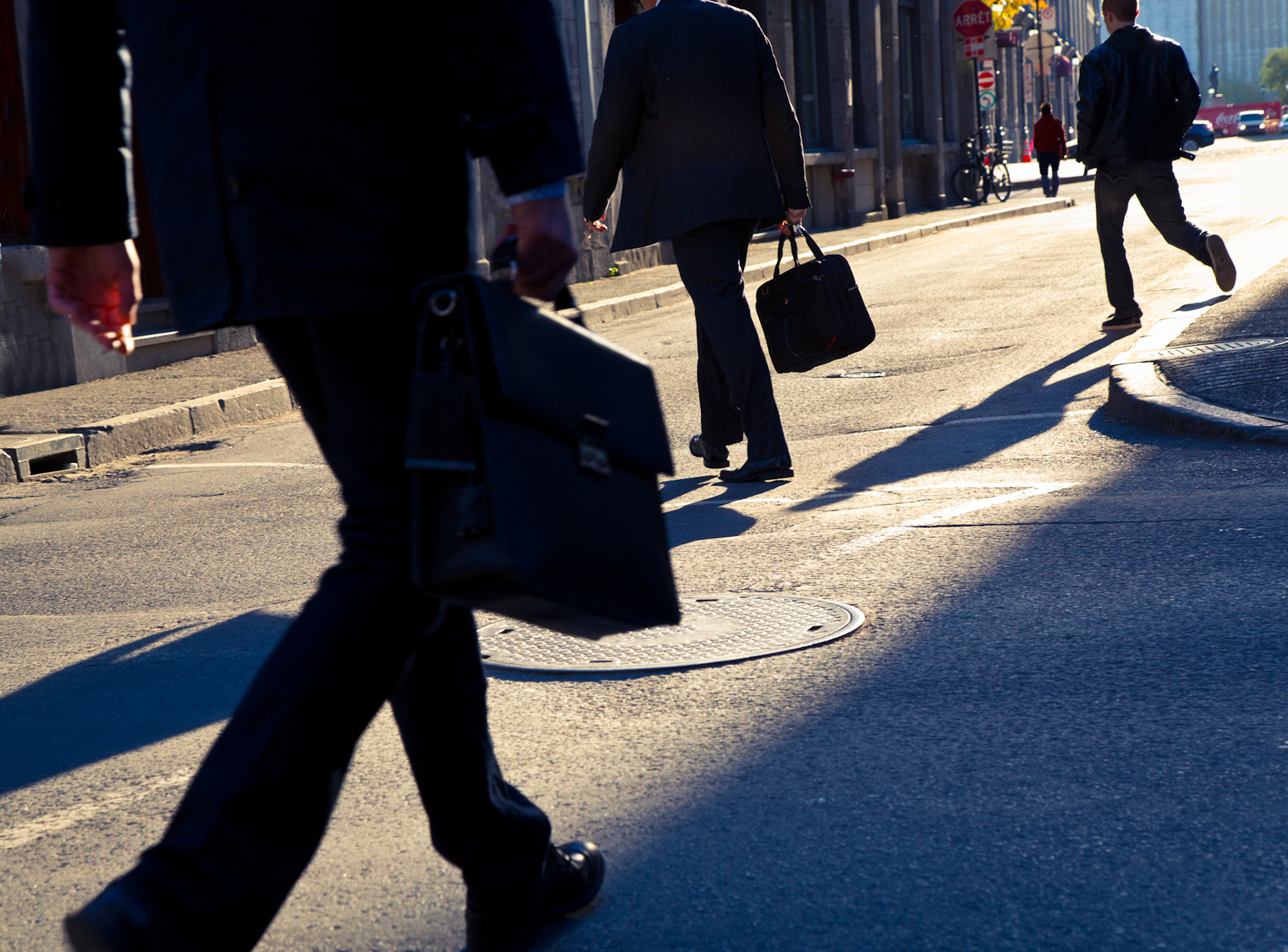 Pedestrians head to the office one morning in Old Montreal, Canada