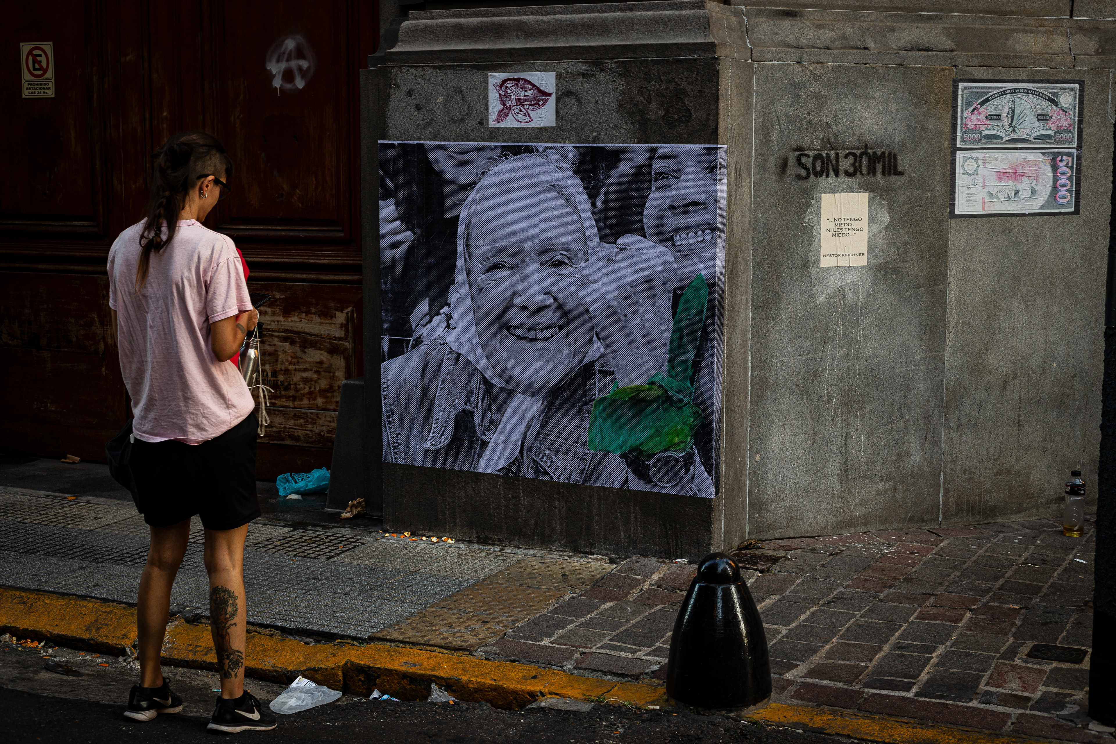 A street art intervention features a portrait of Norita Cortiñas, psychologist and prominent member of Mothers of Plaza de Mayo, during the National Day of Memory for Truth and Justice in Buenos Aires, Argentina. March 24, 2024. (Photo by Catriel Gallucci Bordoni)​​​​​​​