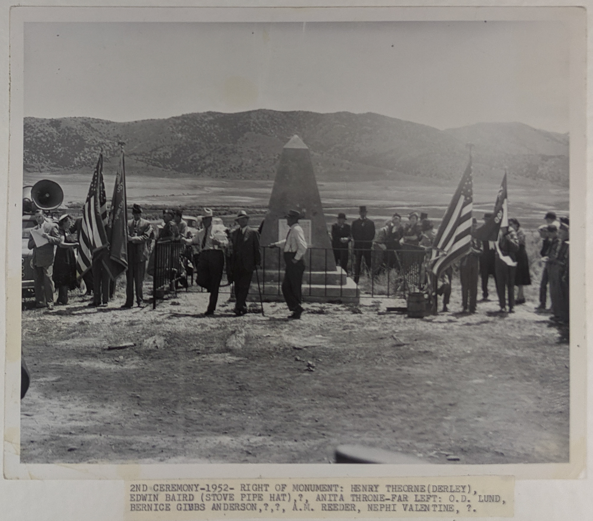 Golden Spike Anniversary, far left: O.D. Lund, Bernice Gibbs Anderson, ?, ?, A. M. Reeder, Nephi Valentine, ? Right of monument: Henry Theorne (Derby), Edwin Baird (stovepipe hat), ?, Anita Throne. May 10, 1952. Bernice Gibbs Anderson Collection, NPS