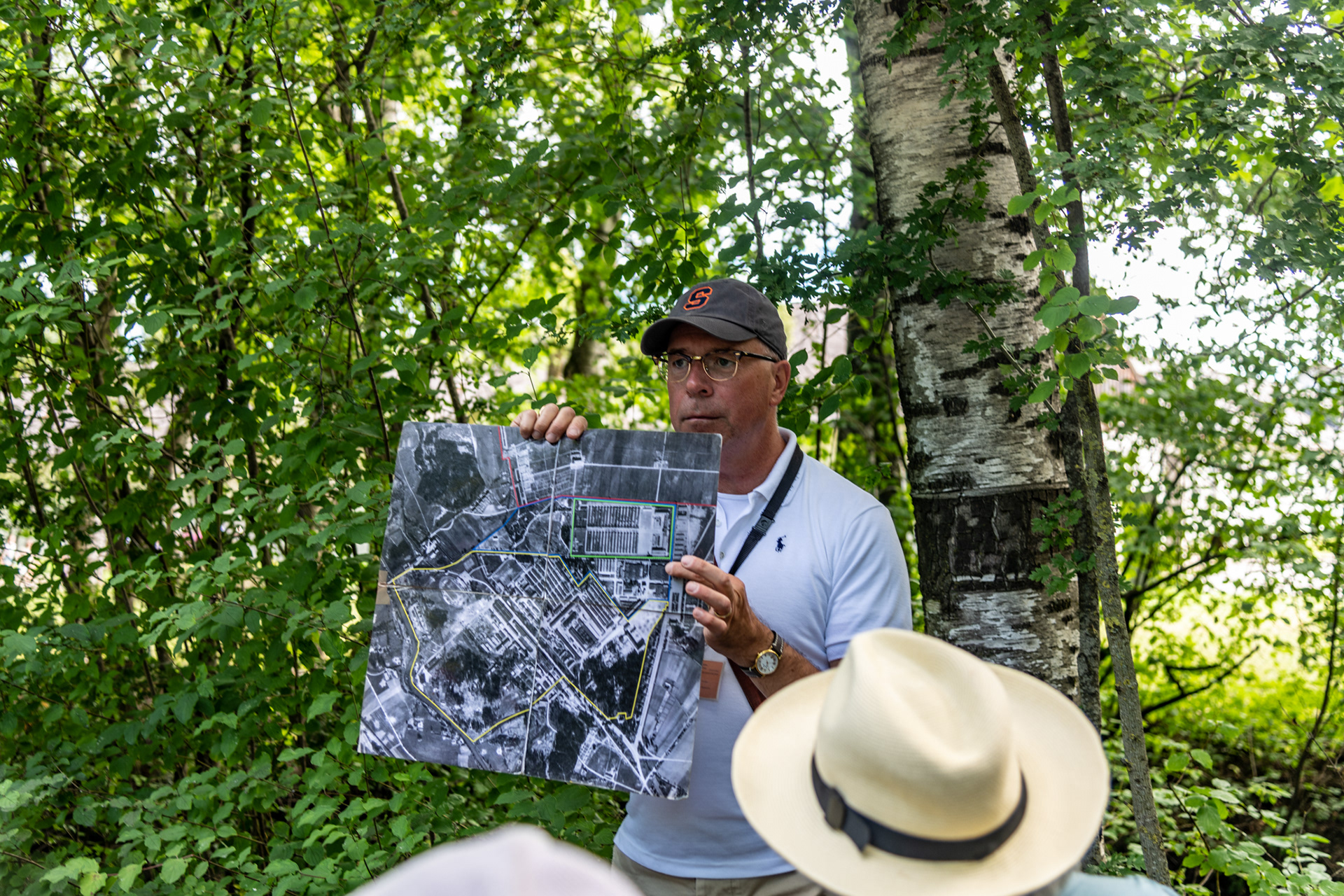 Stefan showing a map of the original camp