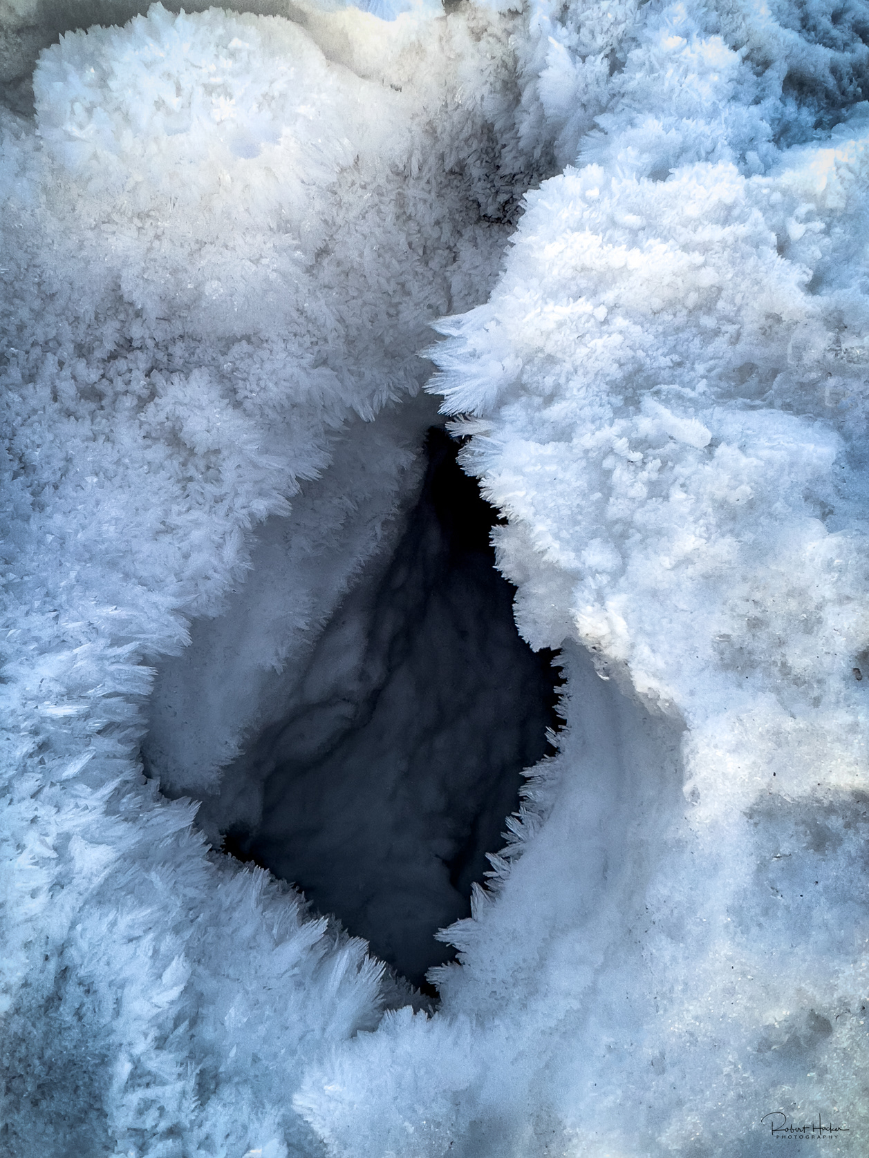 Ice crystals in the rocks along the shore of the bay at Reykjavik