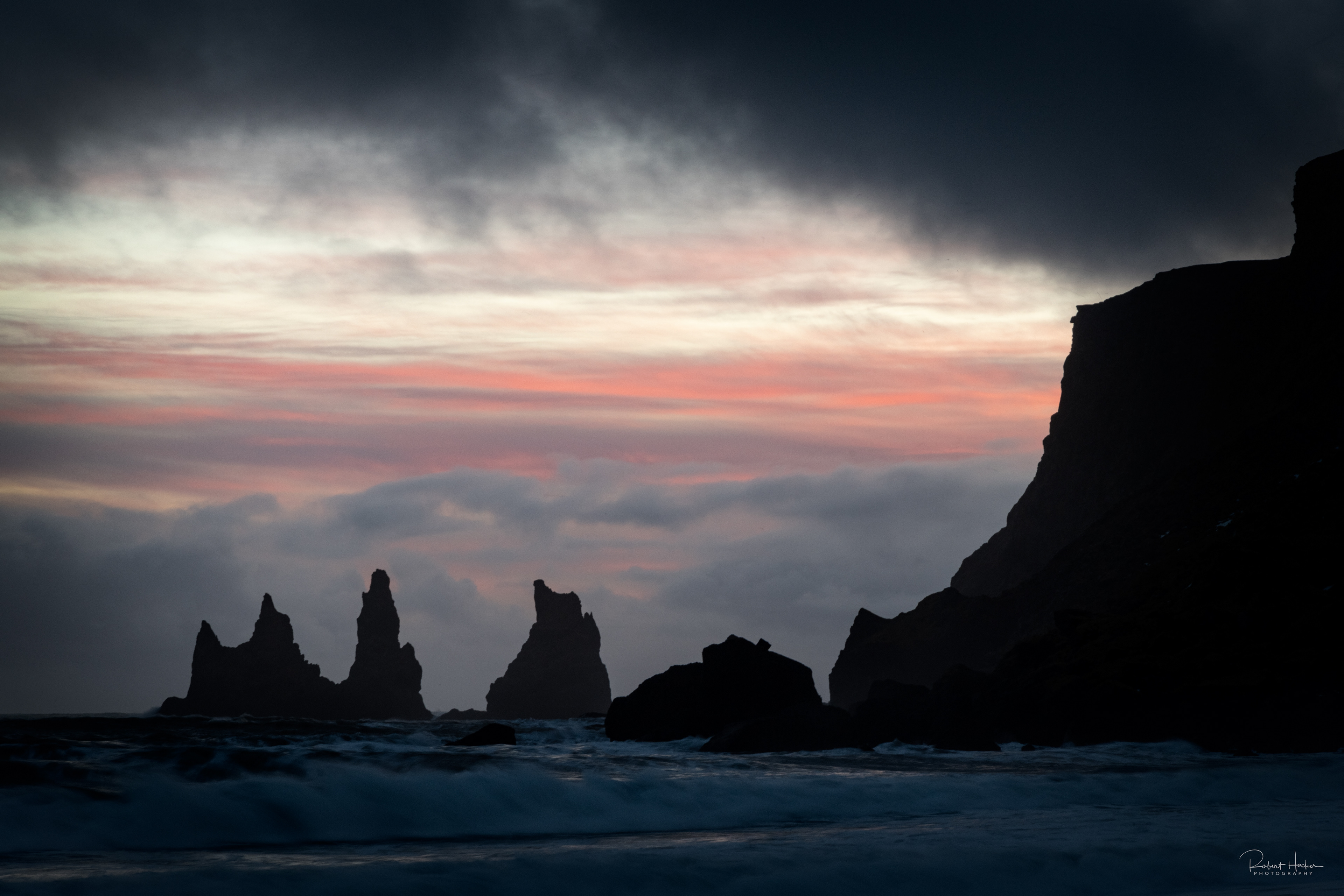 Sea stacks near the black sand beach in Vik on the south coast at sunset