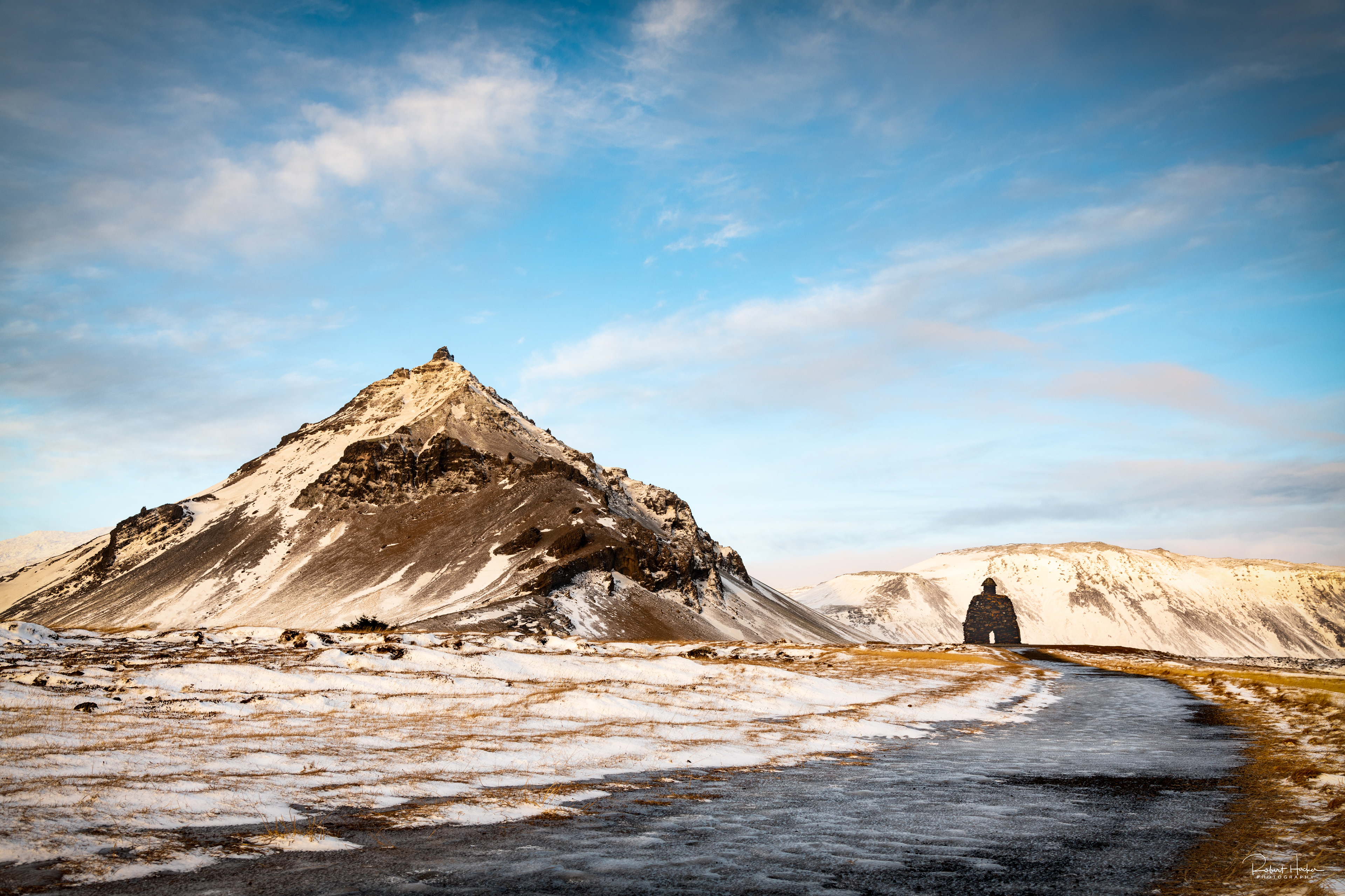 The statue of Bárður Snæfellsás and Mt. Stapafell near Arnarstapi