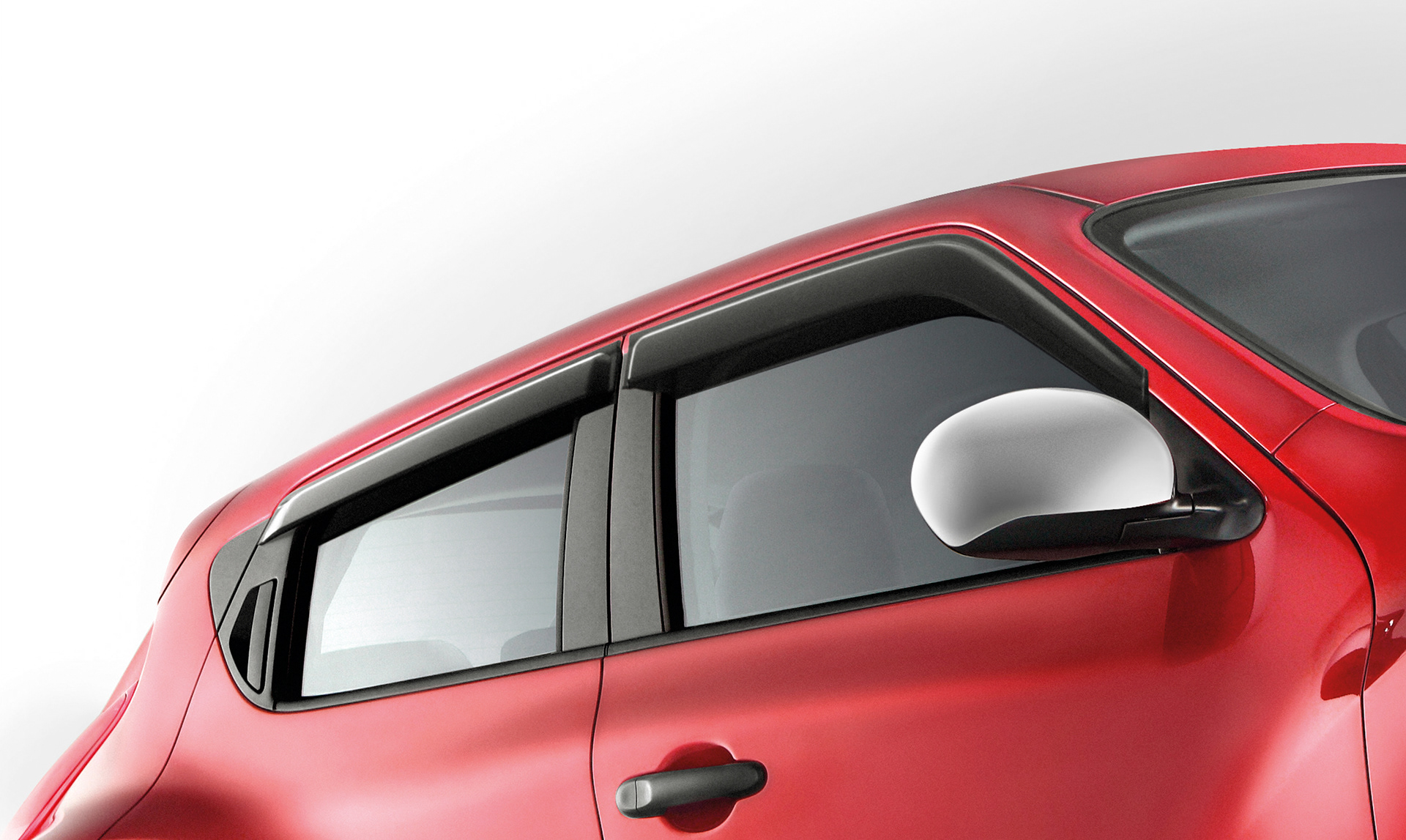 Tight cropped shot of Nissan Juke showing rear and front side windows.