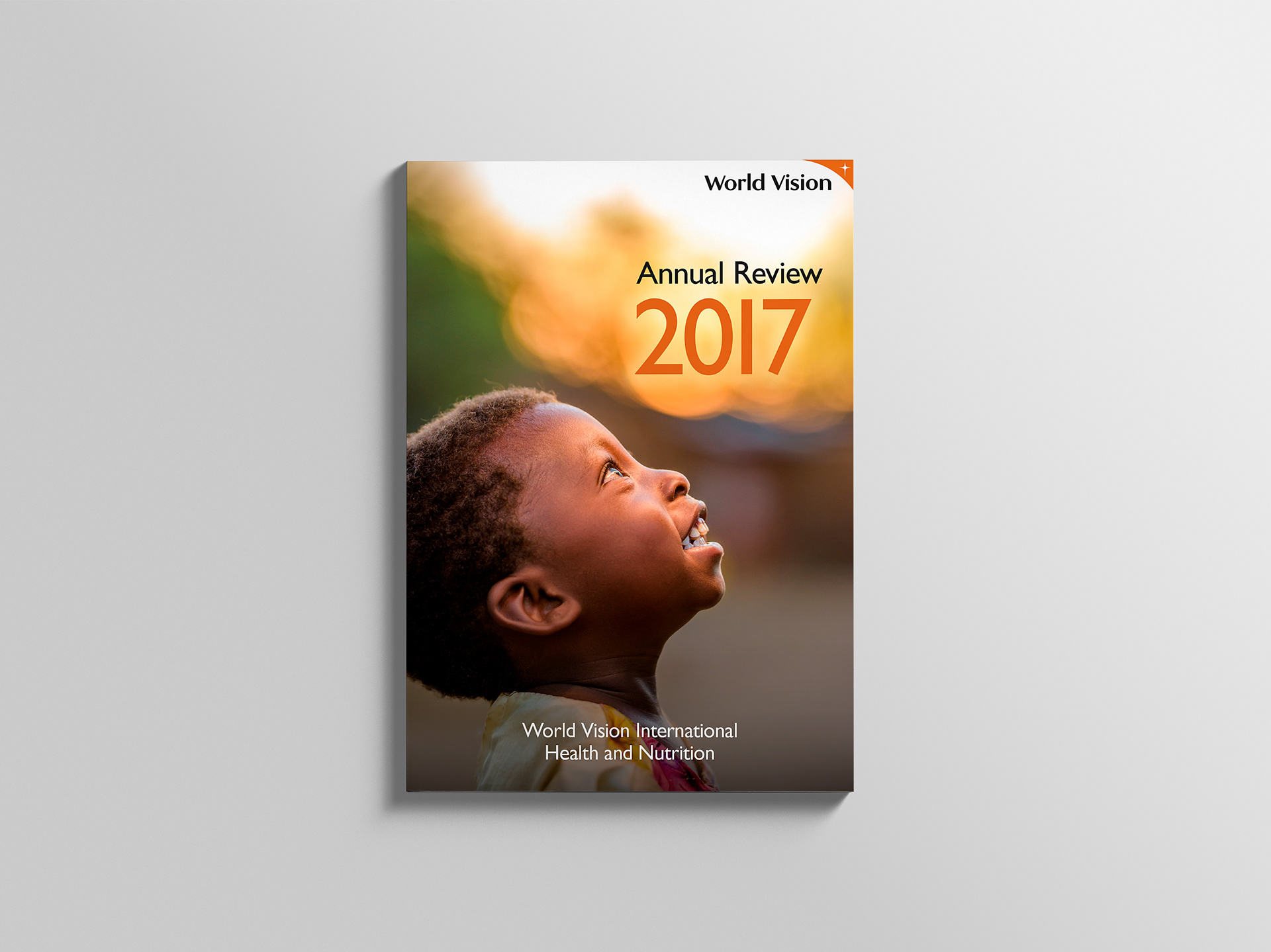 Front cover showing a smiling young boy looking up to the title of the publication.