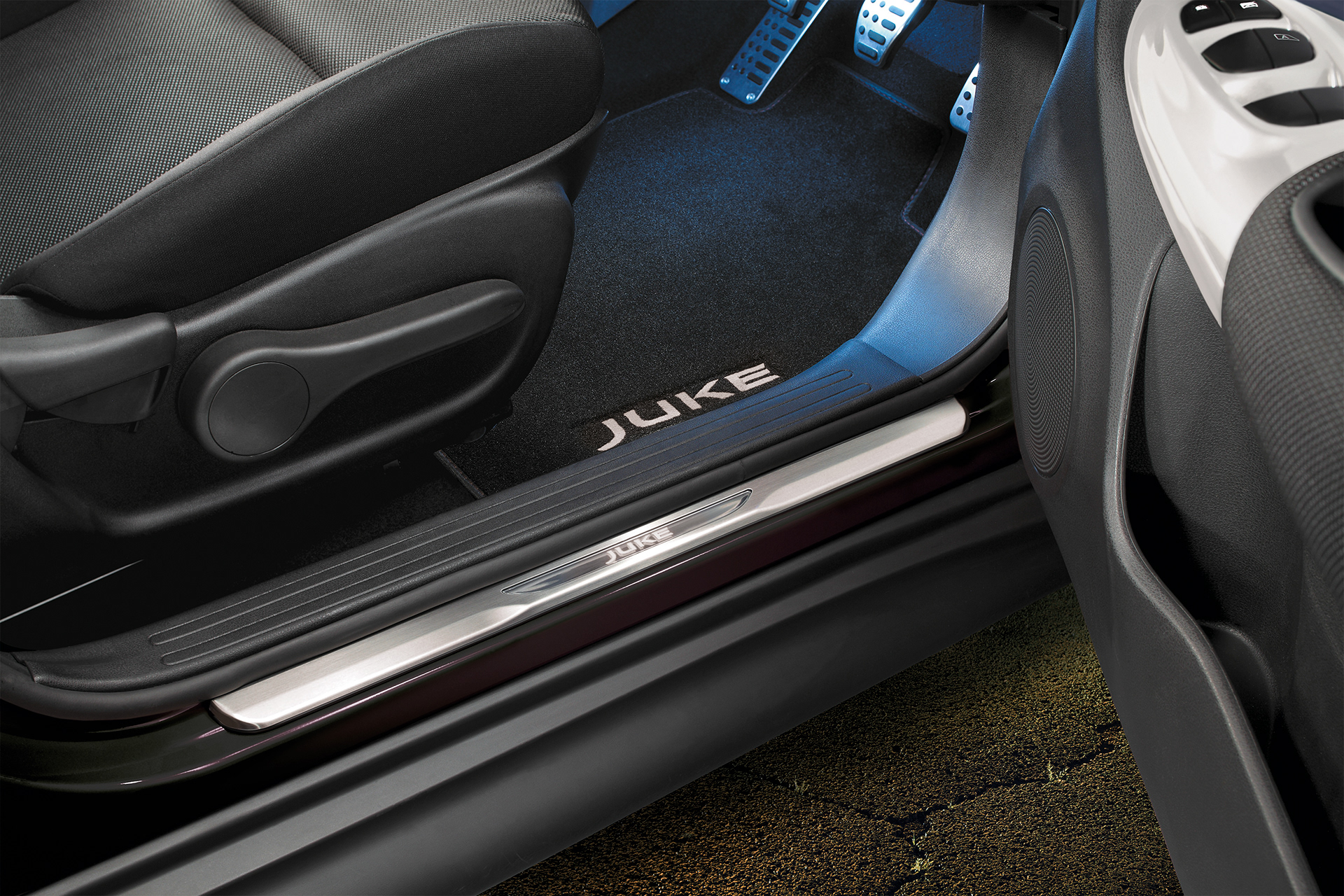 Open driver’s side door showing interior lighting and chrome trim.