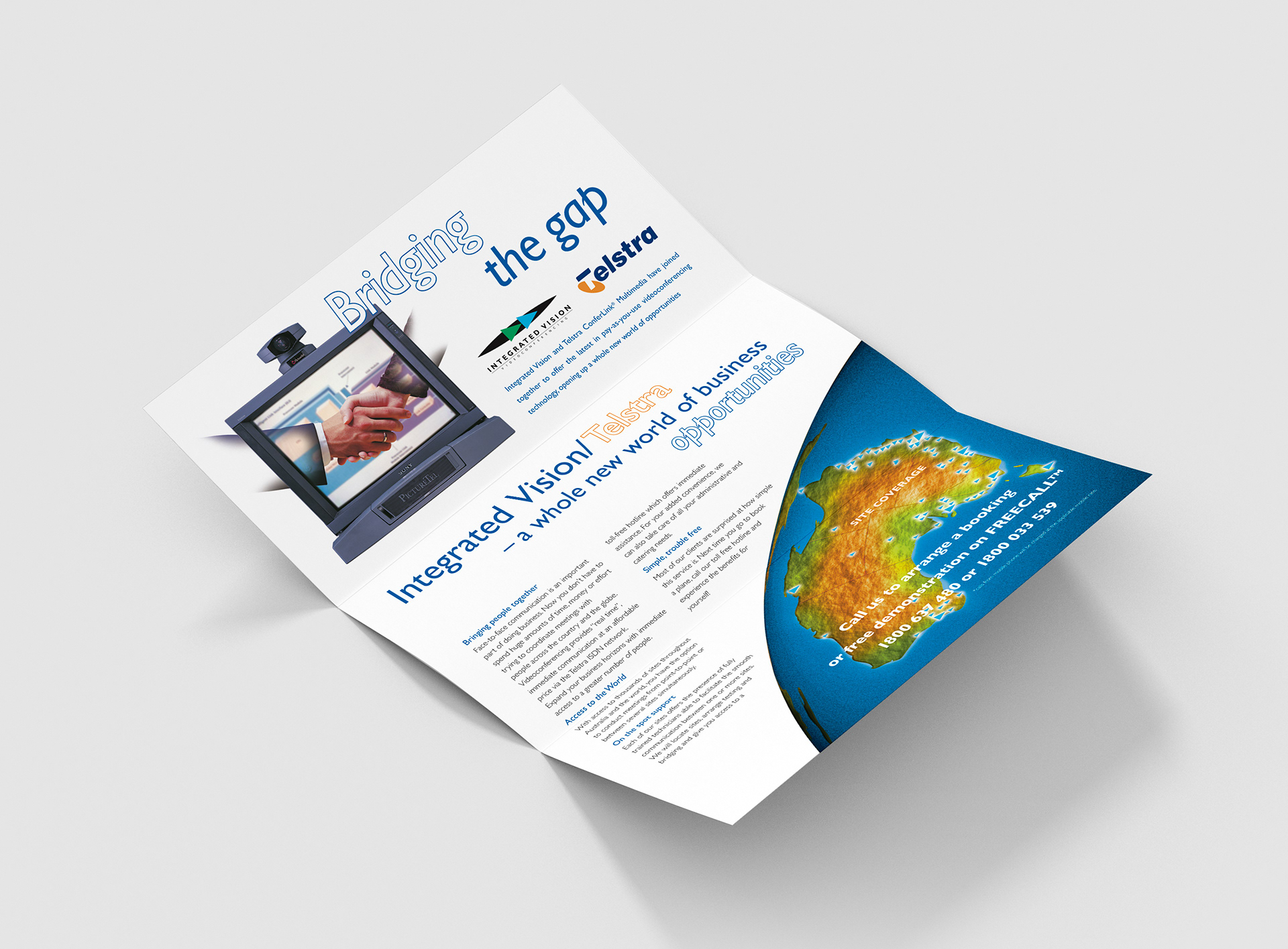 DL brochure internal layout showing graphics of hands shaking virtually through monitor and site locations map.