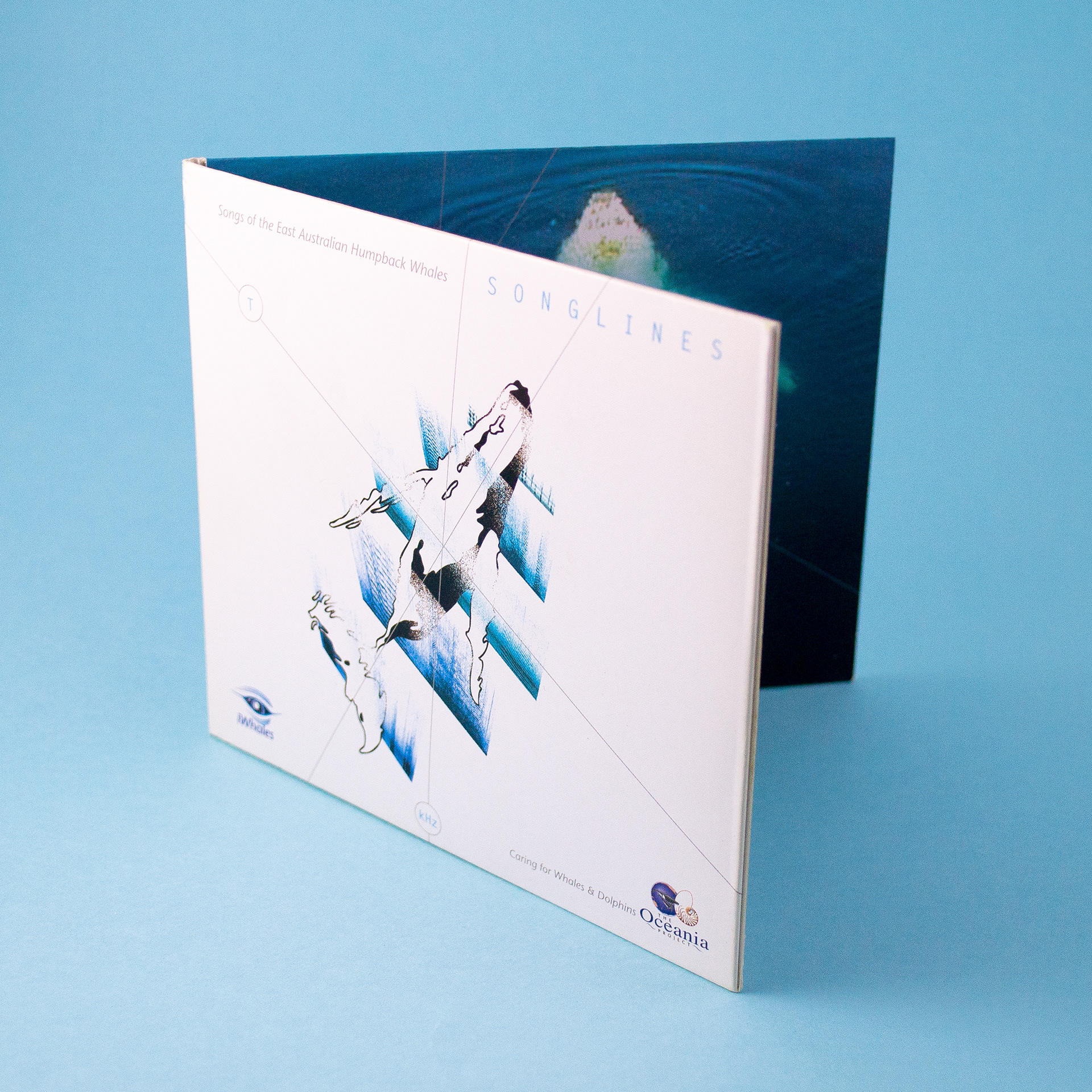Songlines CD cover with illustration of Humpback Whale floating through sound waves, and logo.