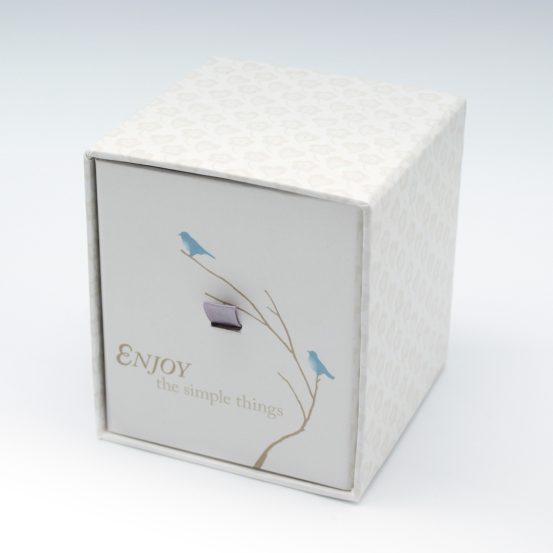 Enjoy - type and illustration composition on scented candle box packaging.