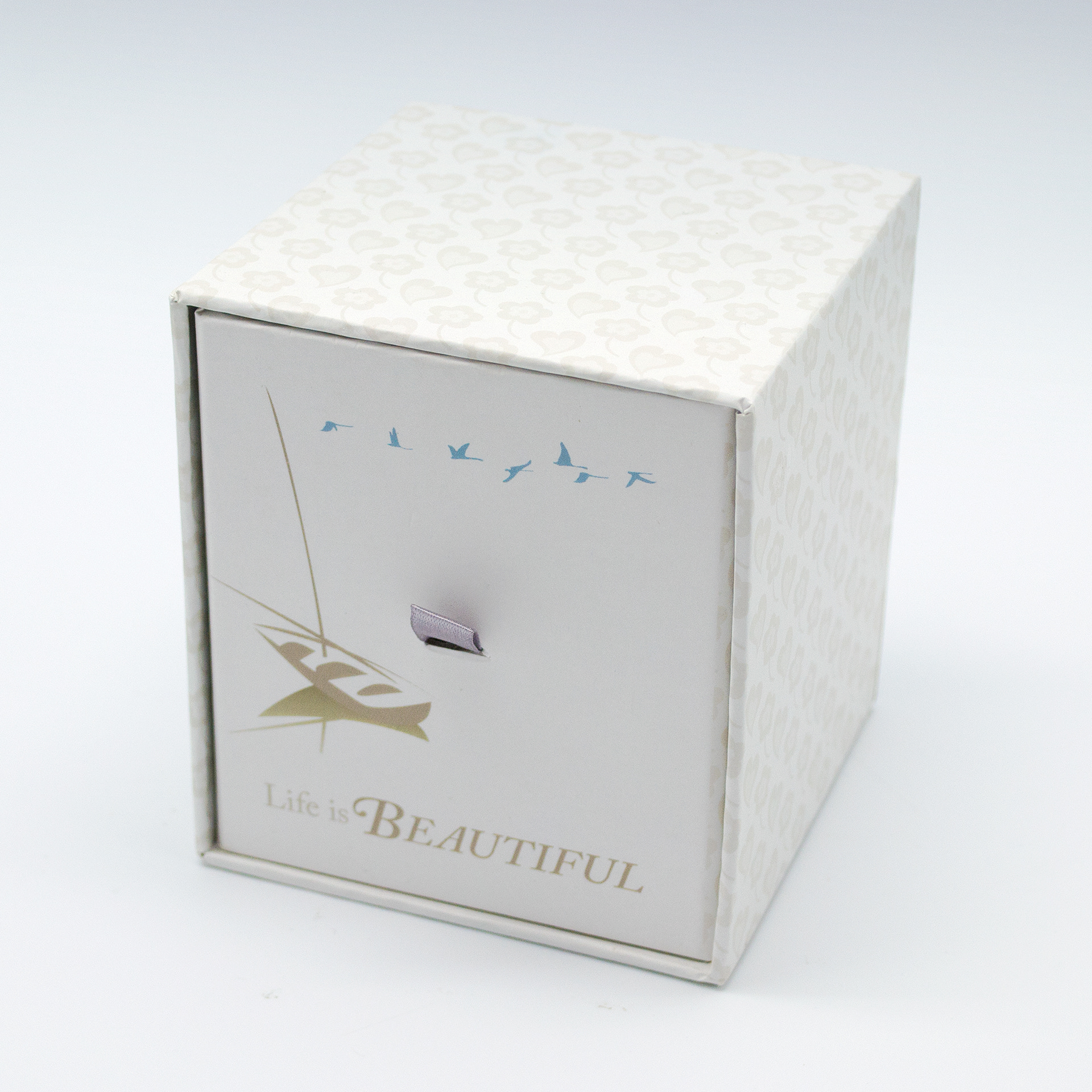 Beautiful - type and illustration composition on scented candle box packaging.