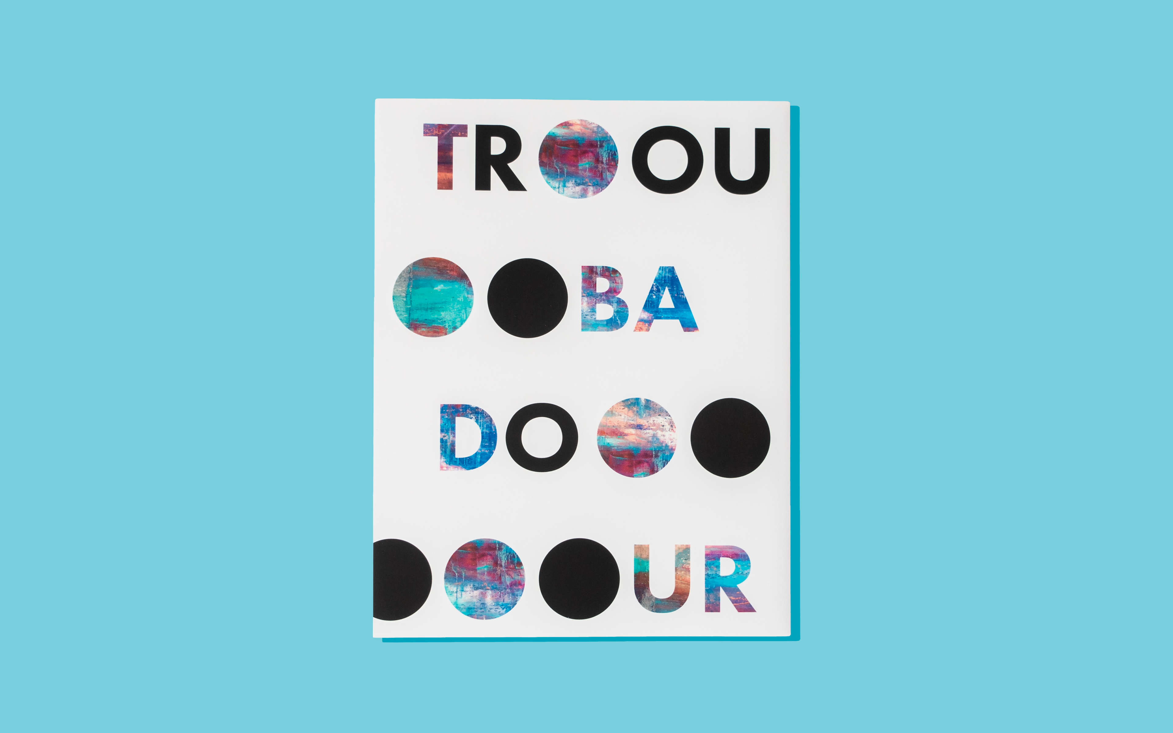 Back cover of the Troubadour 2019 print book that has the words "Troubadour" spread out the page from top to bottom.