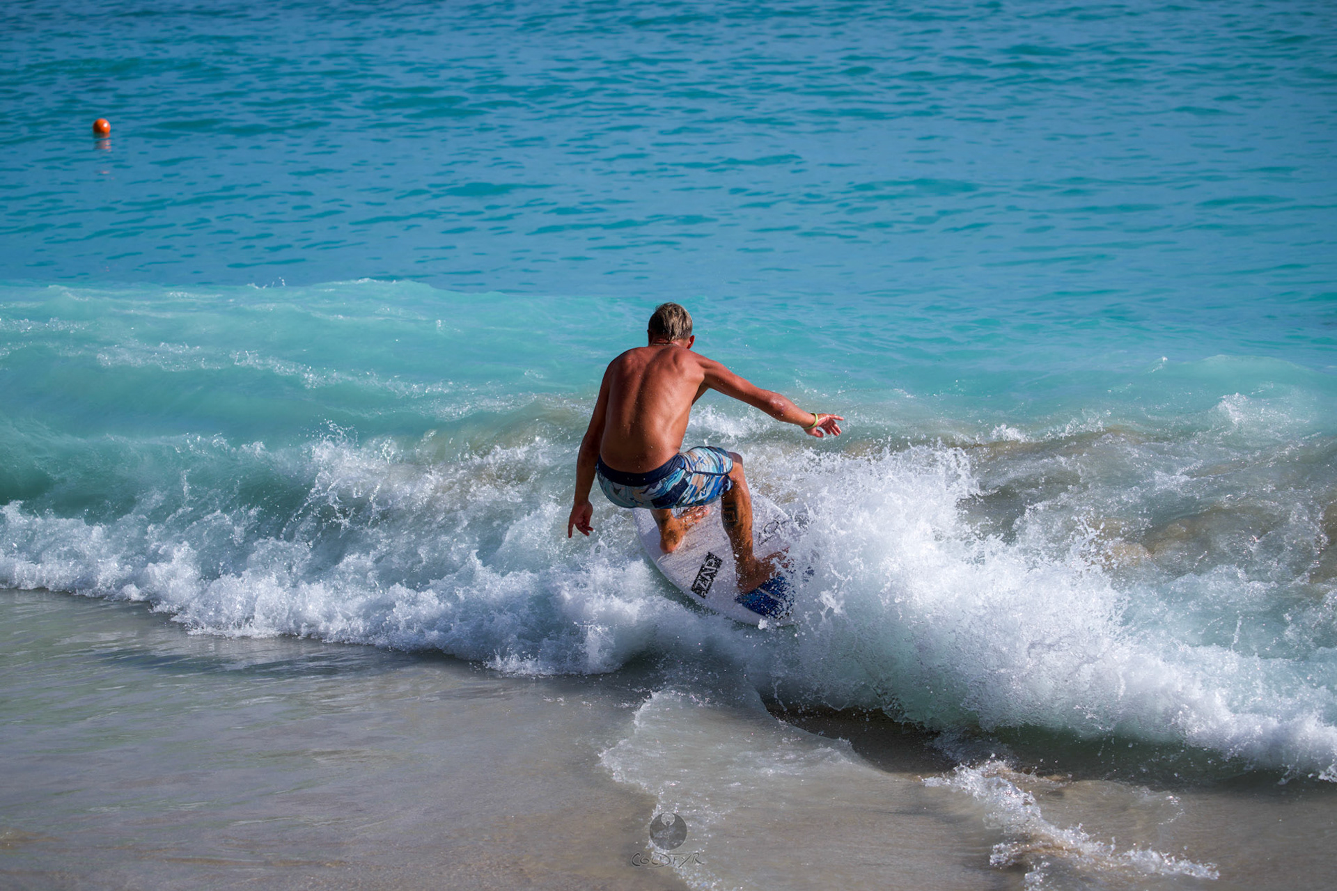 Brian "Hollywood" rips the Waikiki shore break.