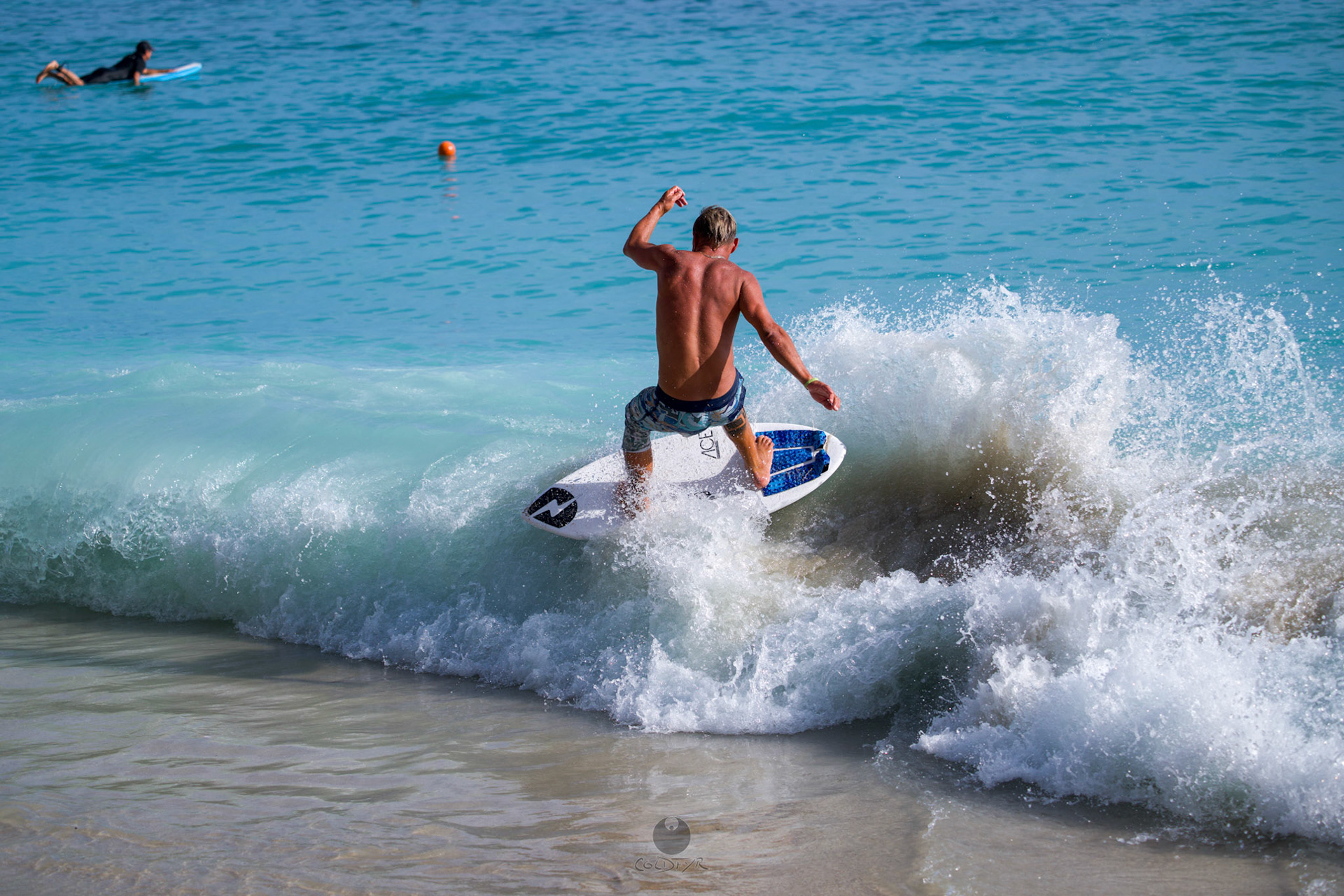 Brian "Hollywood" rips the Waikiki shore break.