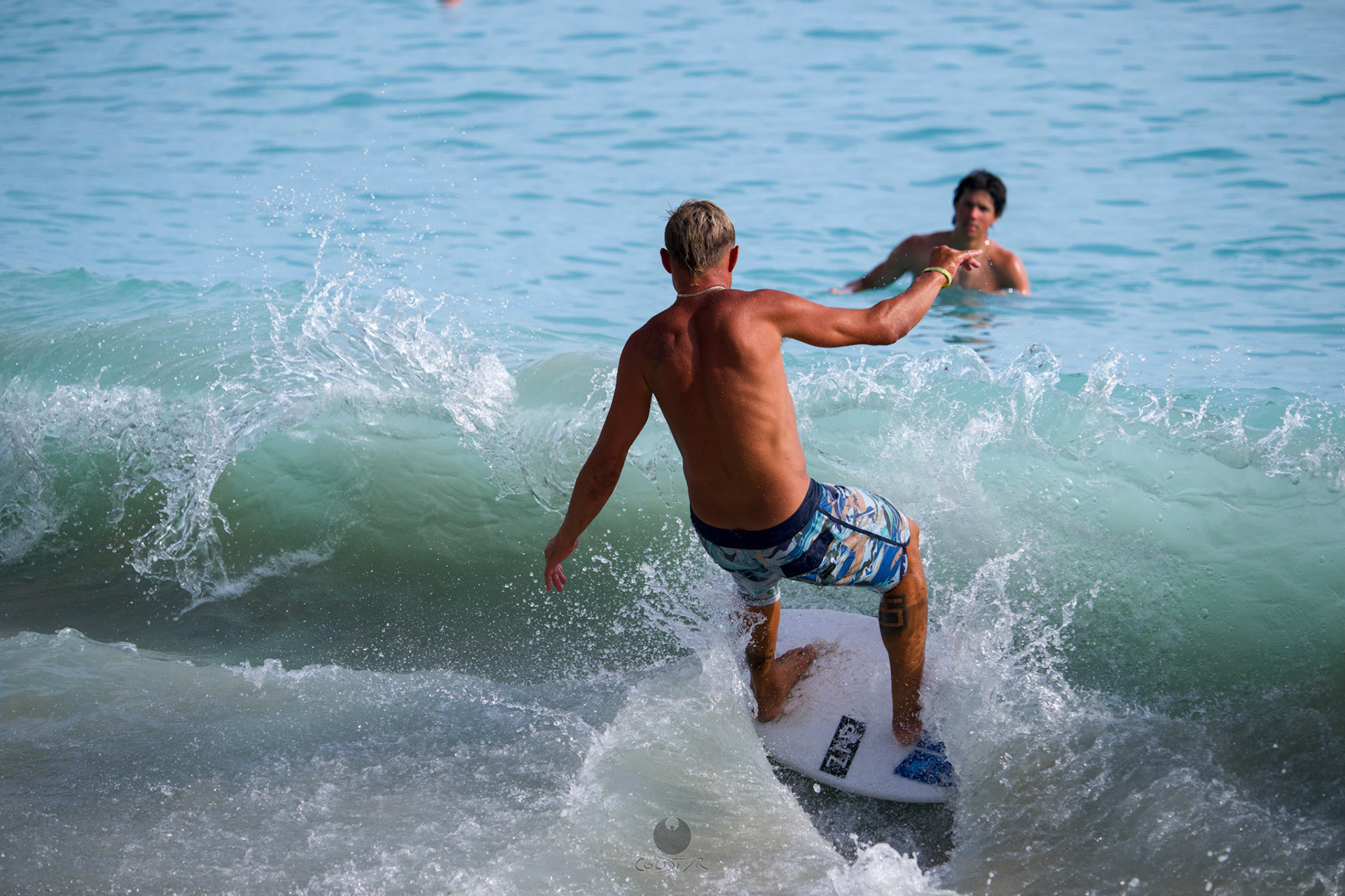 Brian "Hollywood" rips the Waikiki shore break.