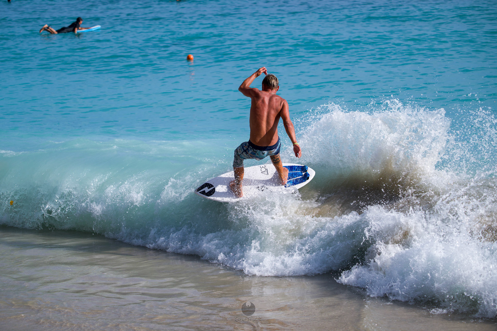 Brian "Hollywood" rips the Waikiki shore break.
