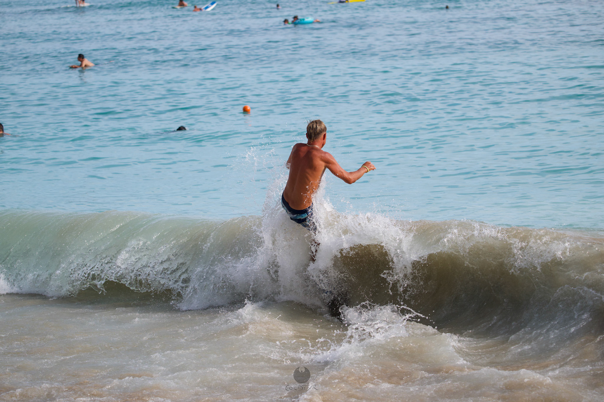 Brian "Hollywood" rips the Waikiki shore break.
