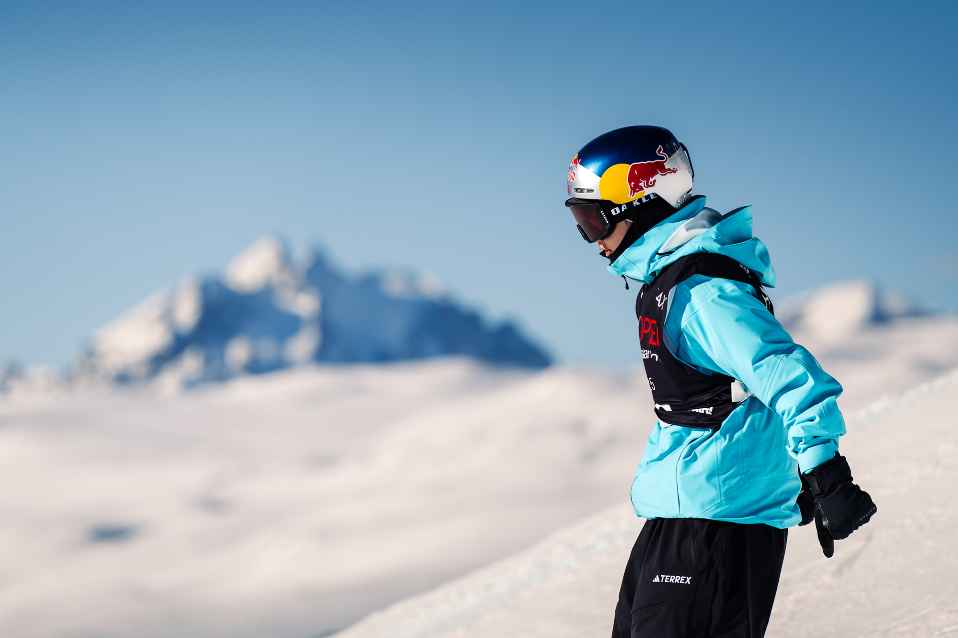 Suyi Ming, red Bull, Adidas Terrex, Oakley Athlete prepares to drop into the Laax Slopestyle course.