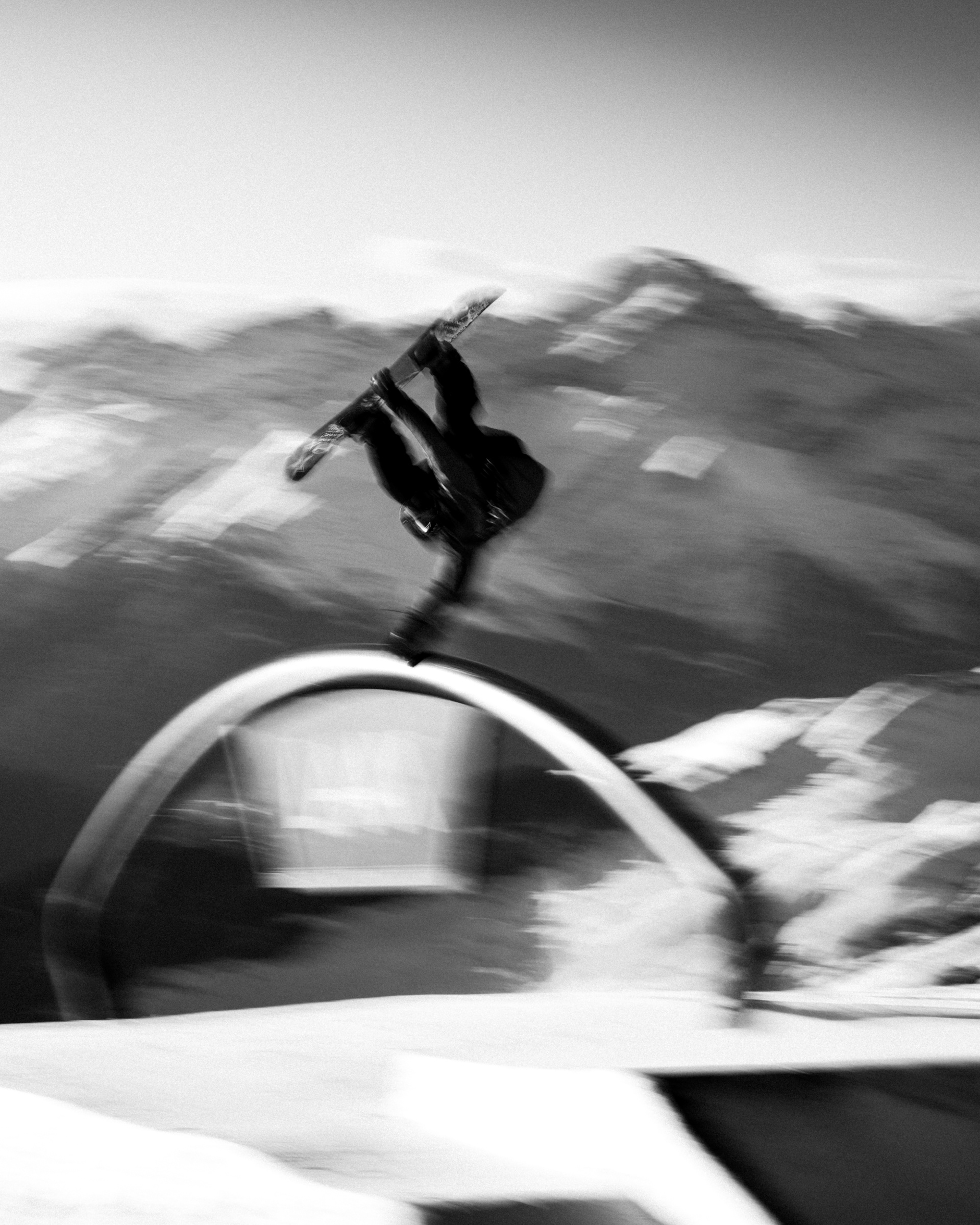 Red Gerard, Rockstar energy athlete, hand drags the rainbow rail infront of the Swiss alps. Laax Open 2025, Rockstar Energy drink, Oakley