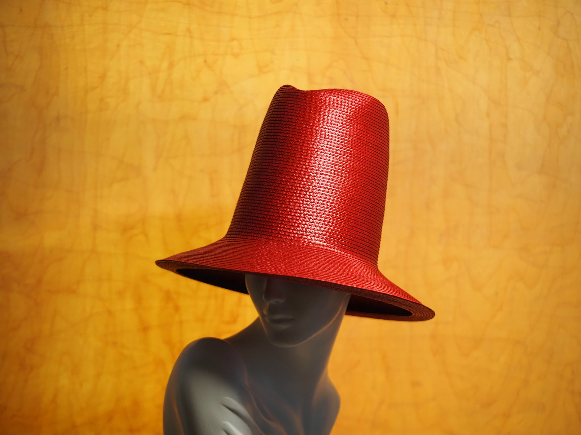 URMIA • elongated homburg in stitched braid