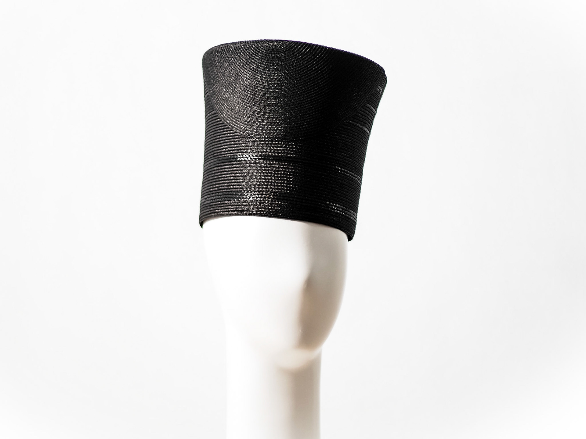 YURIA • flared toque in stitched braid