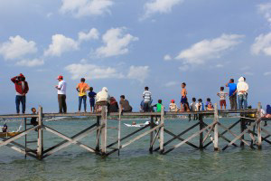 Local people watching the traditional boat competition