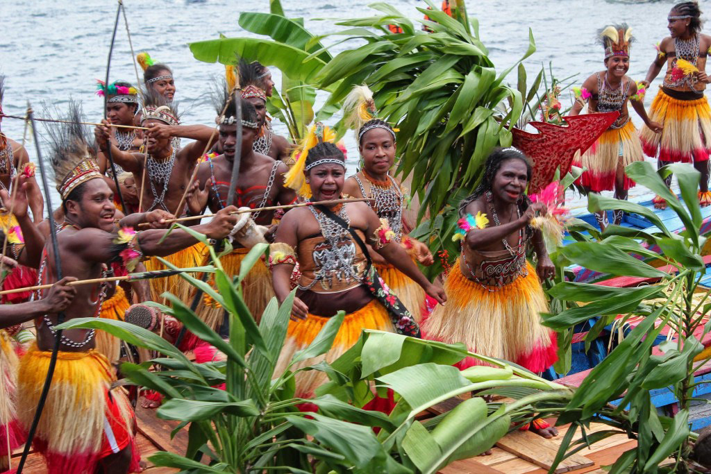 Isolo dance: A group of different age and gender dancing joyfully together