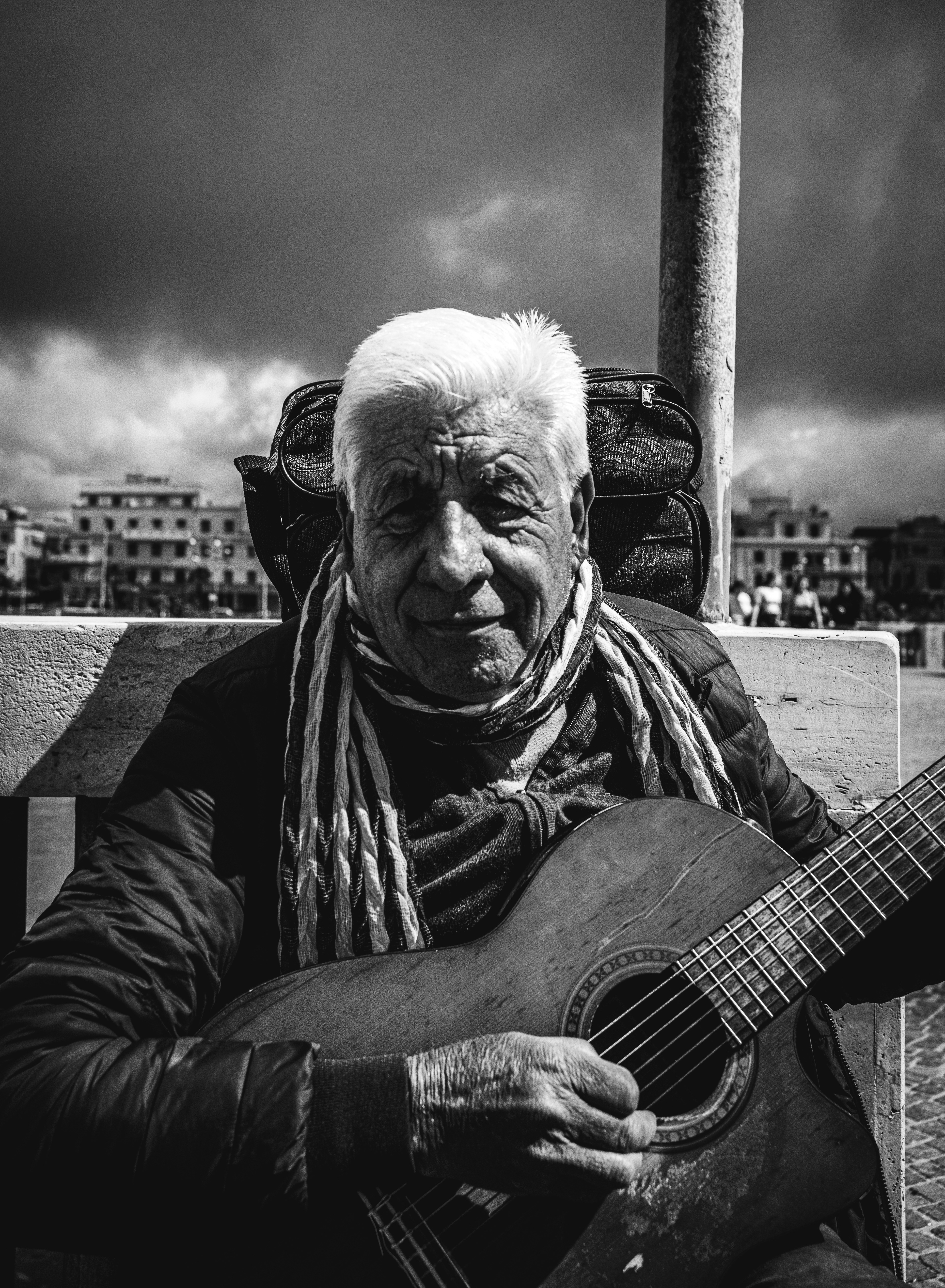 Ostia. He is Giorgio and comes from Bulgaria. Play his guitar in front of sea.