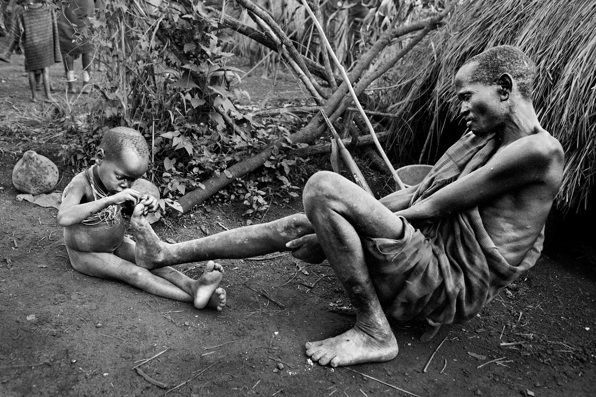 Removing a thorn, Omo Valley, Ethiopia