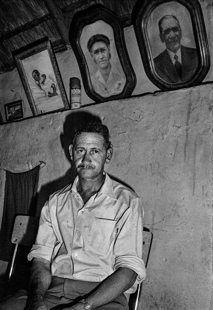 Man at home, Clanwilliam. The can of Doom insecticide above his head adds a visual element of dark prophecy in a country at the crossroads of its history.