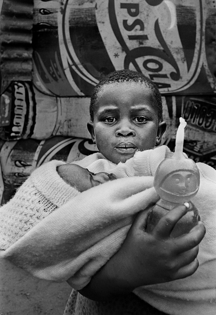 Girl with baby brother, Crossroads