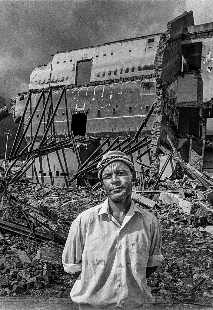 A man stands by the remains of his favourite cinema in District Six.