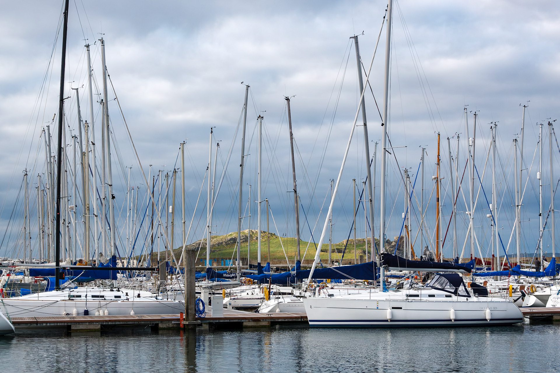 Sailboats docked at the marina