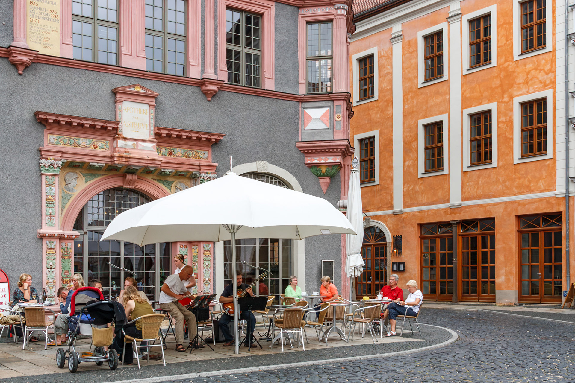 People dining at an outdoor cafe