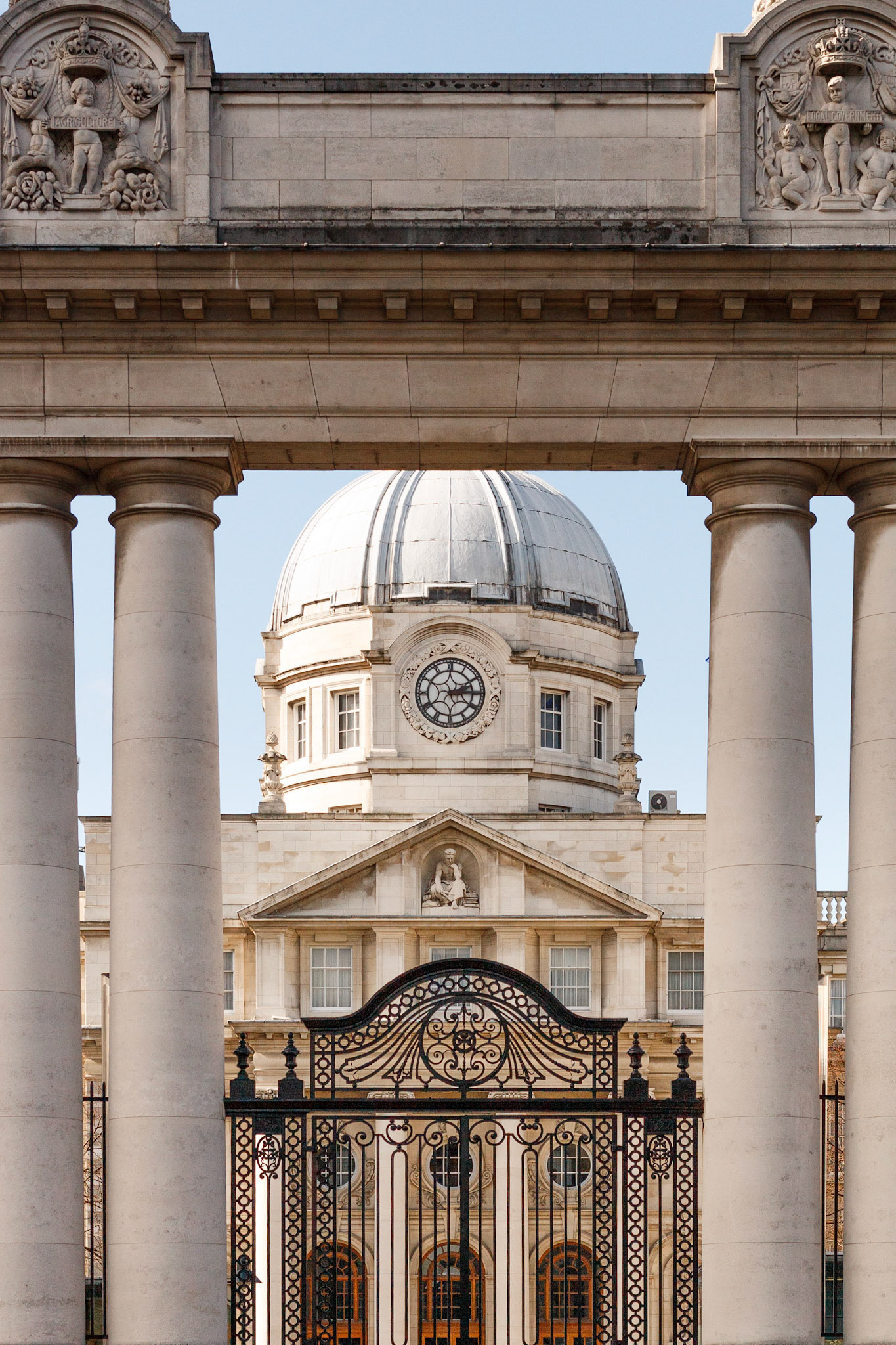 Historic government buildings framed by archway