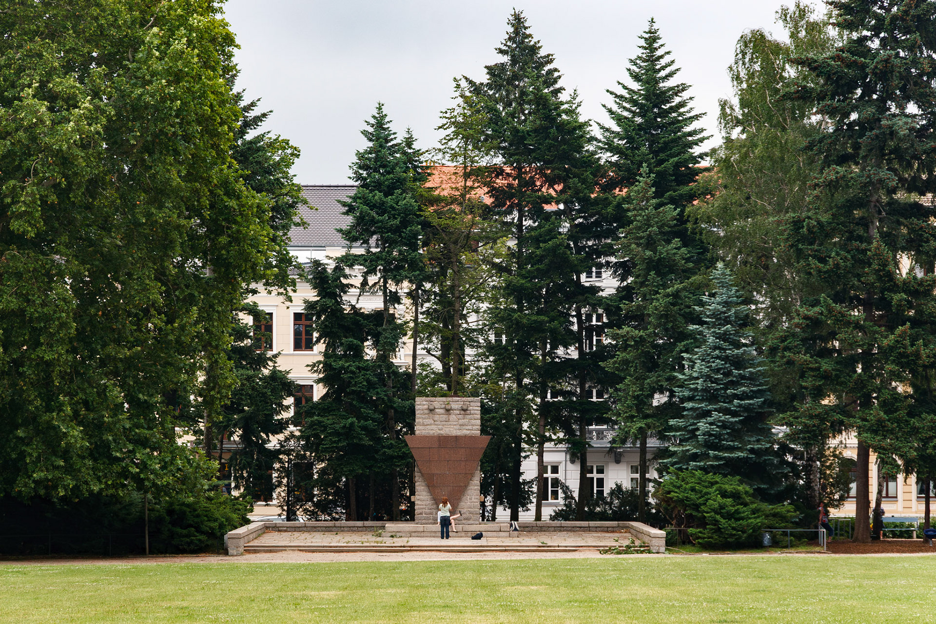 Person standing before a public monument