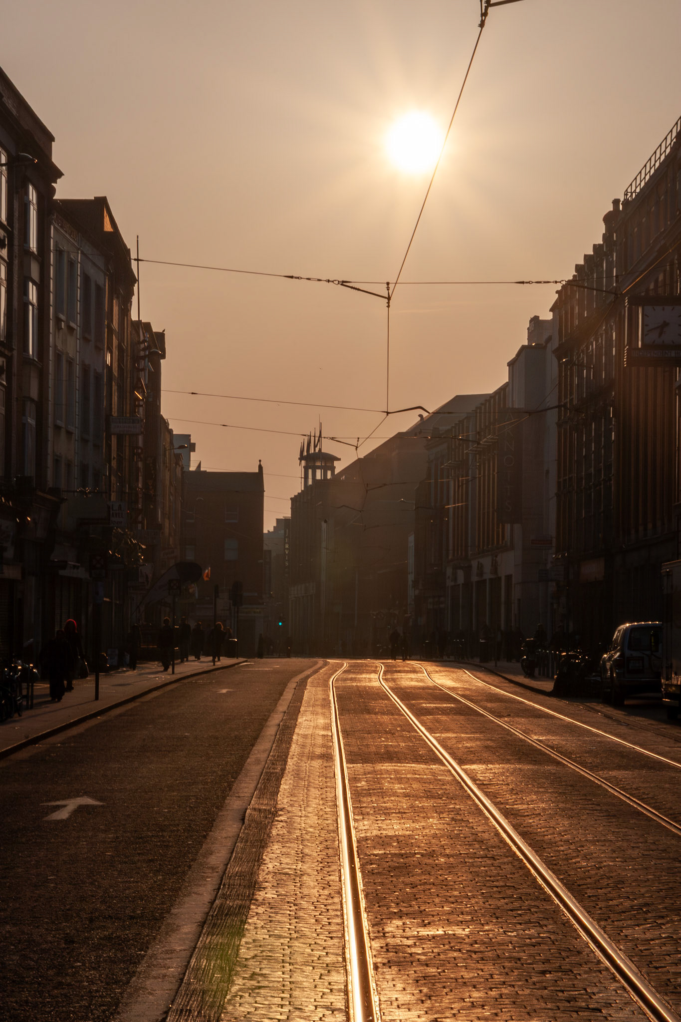 Sunset glowing on urban tram tracks