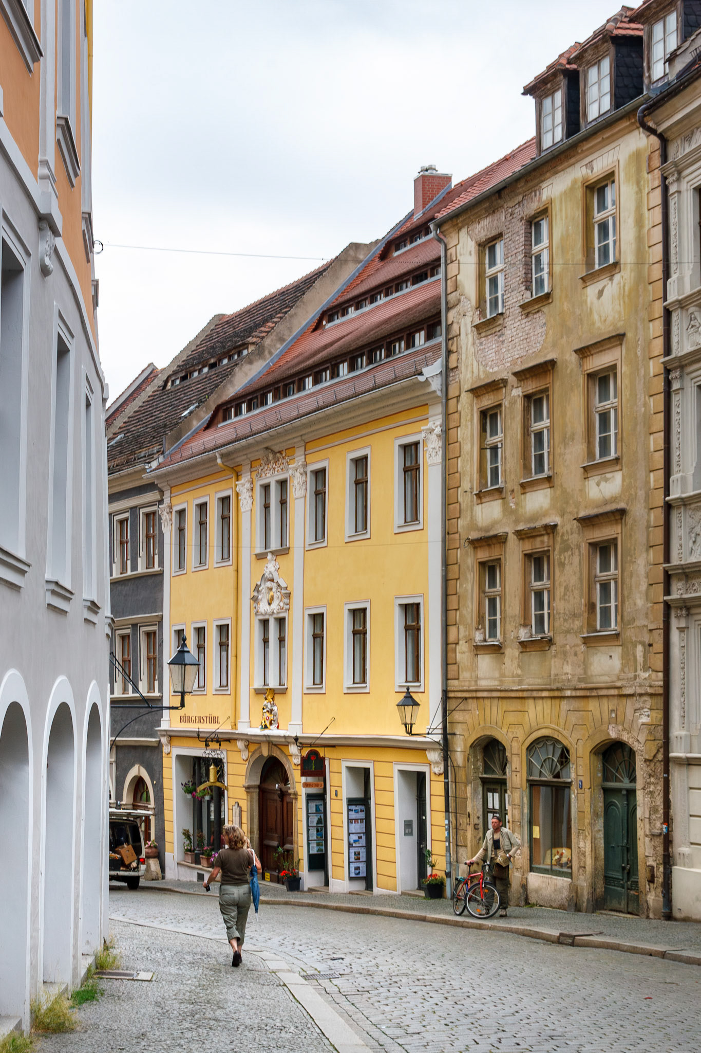 Person walking on historic cobblestone street