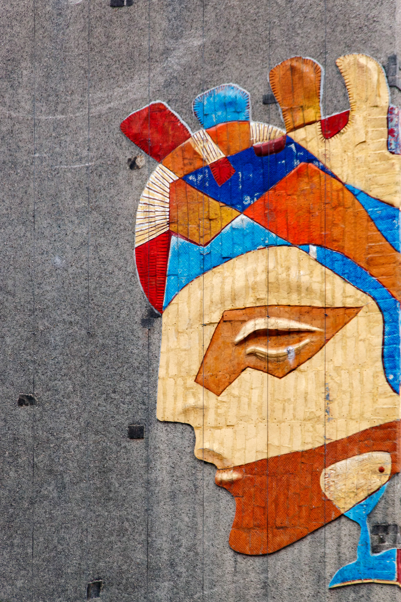 Colorful mosaic mural of a face