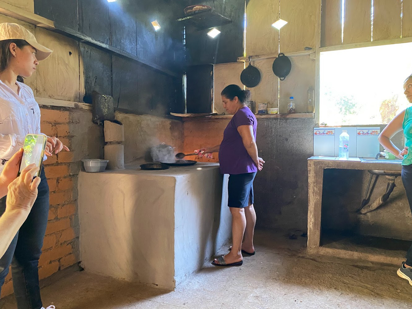 The indoor smoke blackens the walls. This family is also using the smoke to smoke their cheese (seen hanging above the stove)