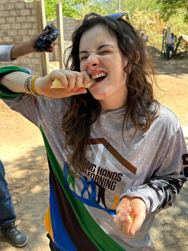 Emma eating some sugar cane