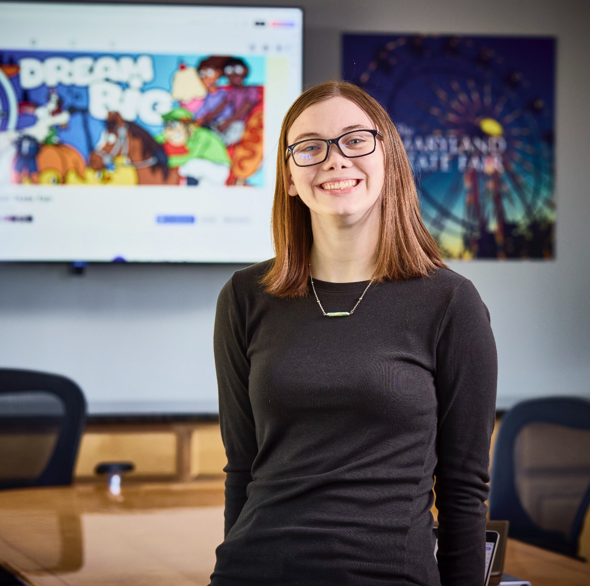 Patch Hatley poses for a photograph in a conference room.