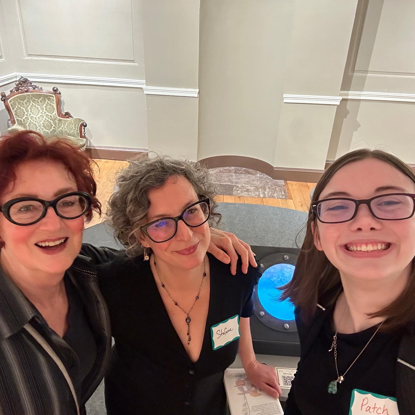 Patricia "Patch" Hatley posing with mentor Cathy Cook and Stefanie Koseff at their installation piece at The Peale.
