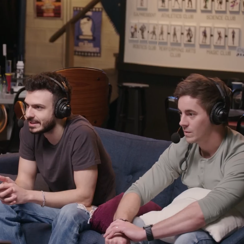 Casters sat on couches and played with toy robots during broadcast.