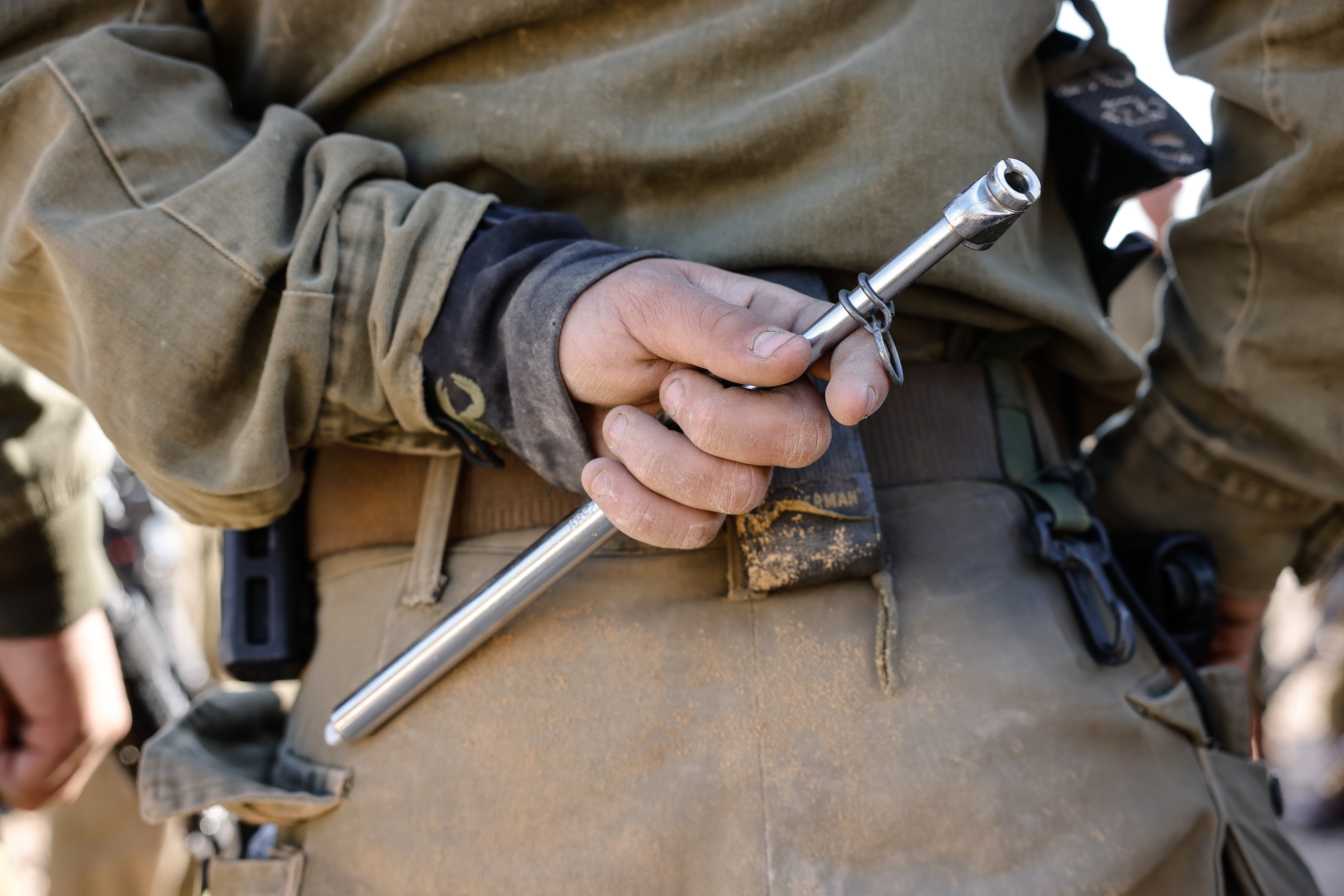 A soldier holding a psi meter