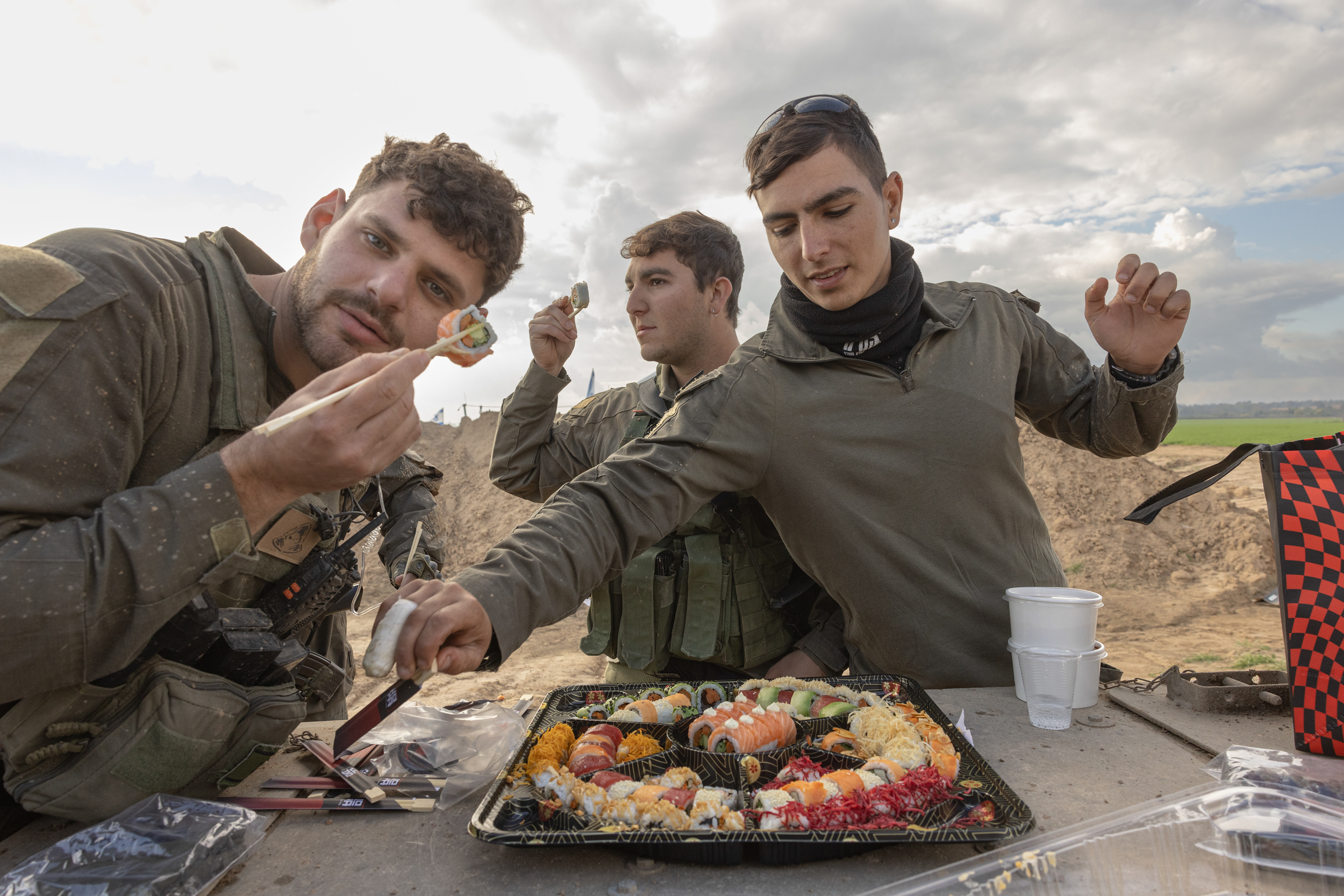 Donors brought a sushi platter, Tom Dori and Ido enjoy it